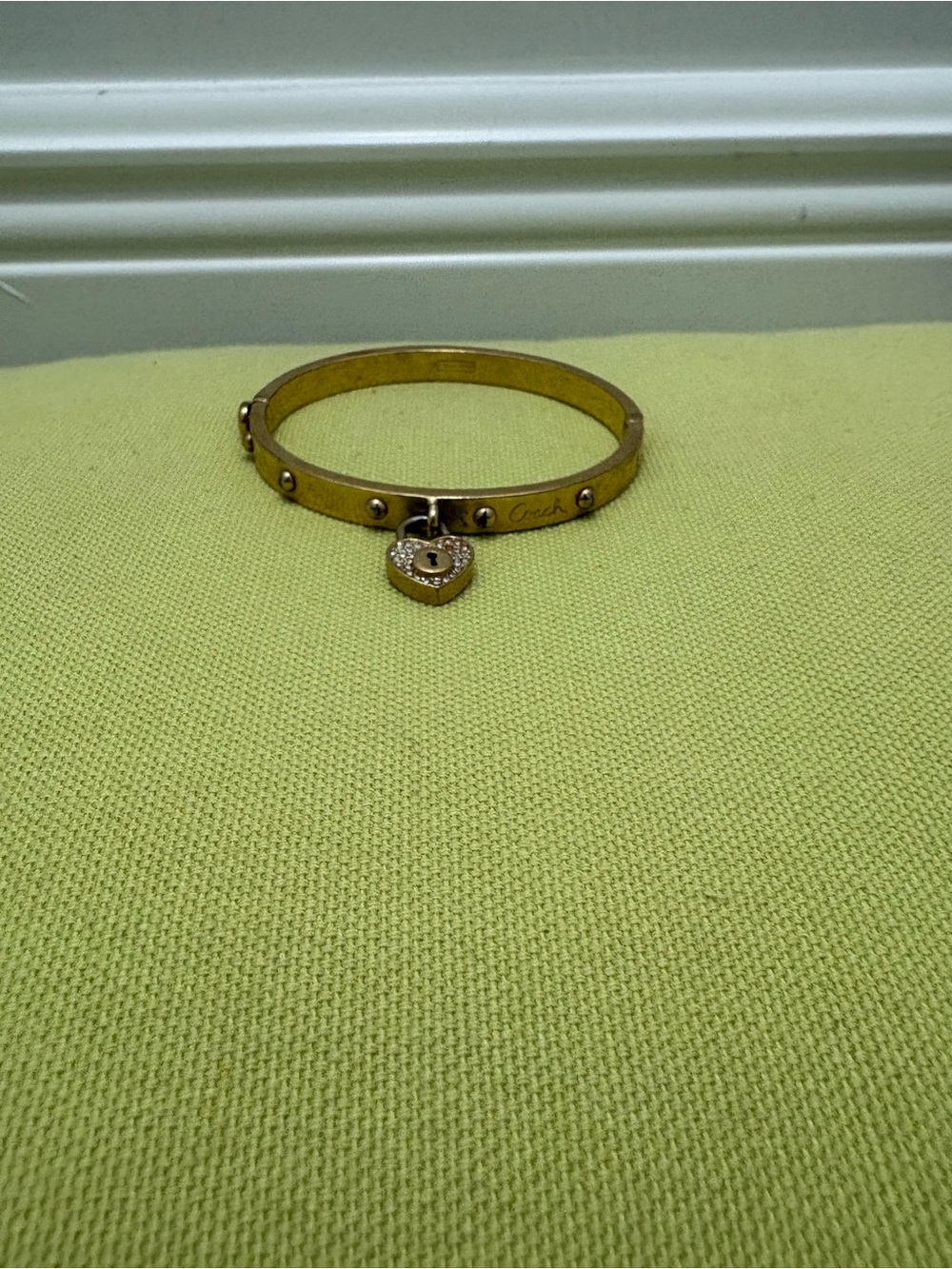 Coach Gold-Tone Heart Lock Charm Bangle Bracelet